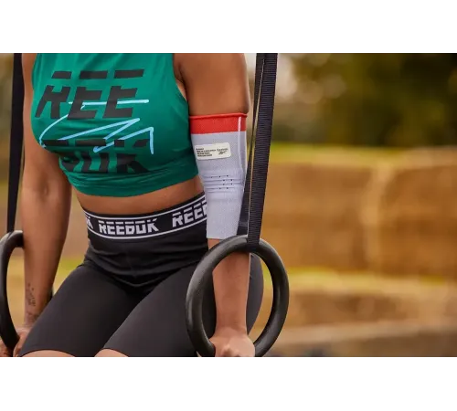 Фіксатор для ліктя Reebok Speedwick Elbow Support розмір S, сіро-червоний