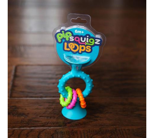 Прорізувач-брязкальце на присосках Fat Brain Toys pipSquigz Loops бірюзовий (F166ML) Прорізувач-брязкальце на присосках Fat Brain Toys pipSquigz Loops бірюзовий (F166ML)