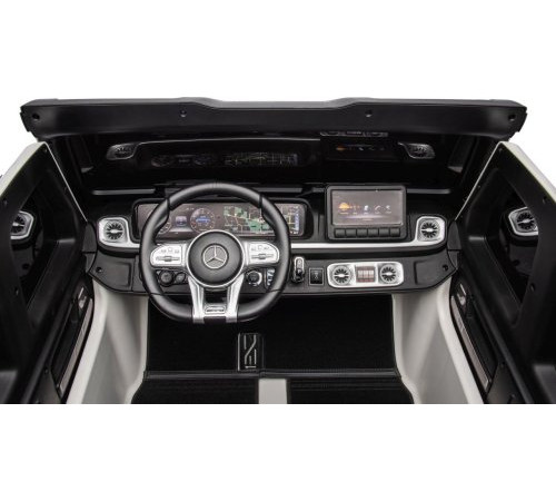 Дитяча акумуляторна машинка Mercedes Benz G63 AMG XXL Біла Дитяча акумуляторна машинка Mercedes Benz G63 AMG XXL Біла