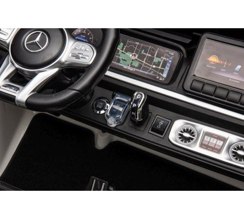 Дитяча акумуляторна машинка Mercedes Benz G63 AMG XXL Біла Дитяча акумуляторна машинка Mercedes Benz G63 AMG XXL Біла